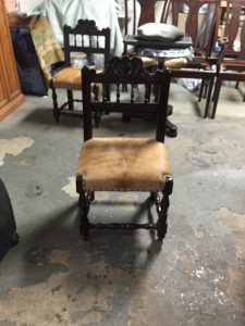 antique reupholstered cow hide chair